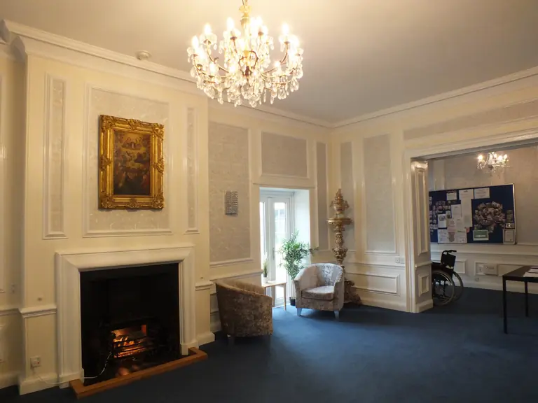 The elegant main lounge and fireplace